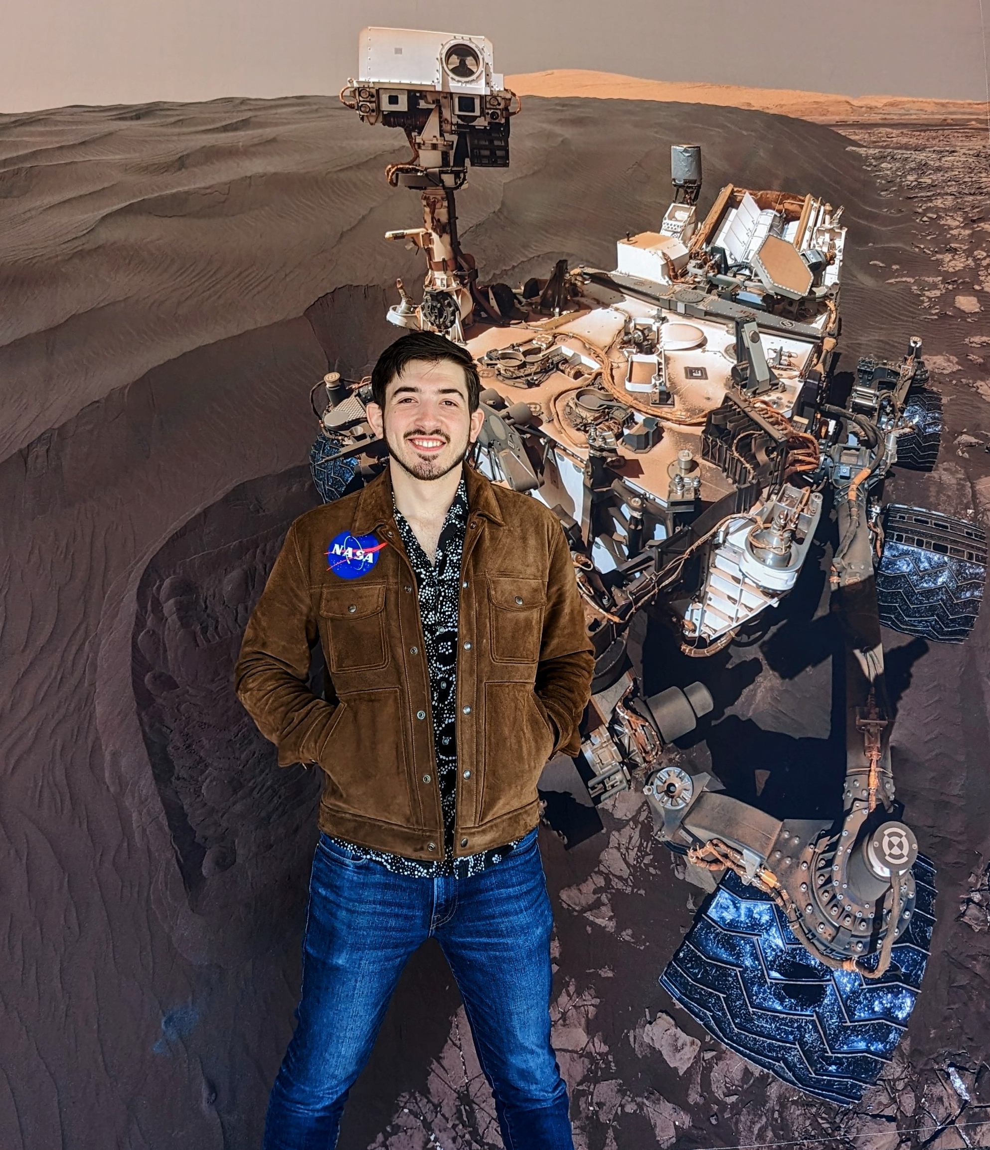 Zak in front of the Curiosity Rover
