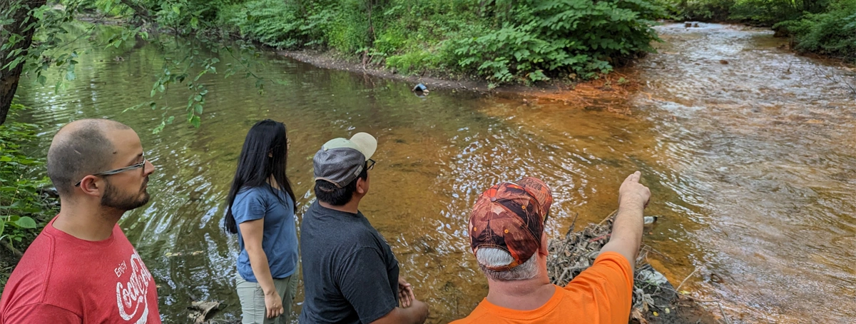 Students observing a river